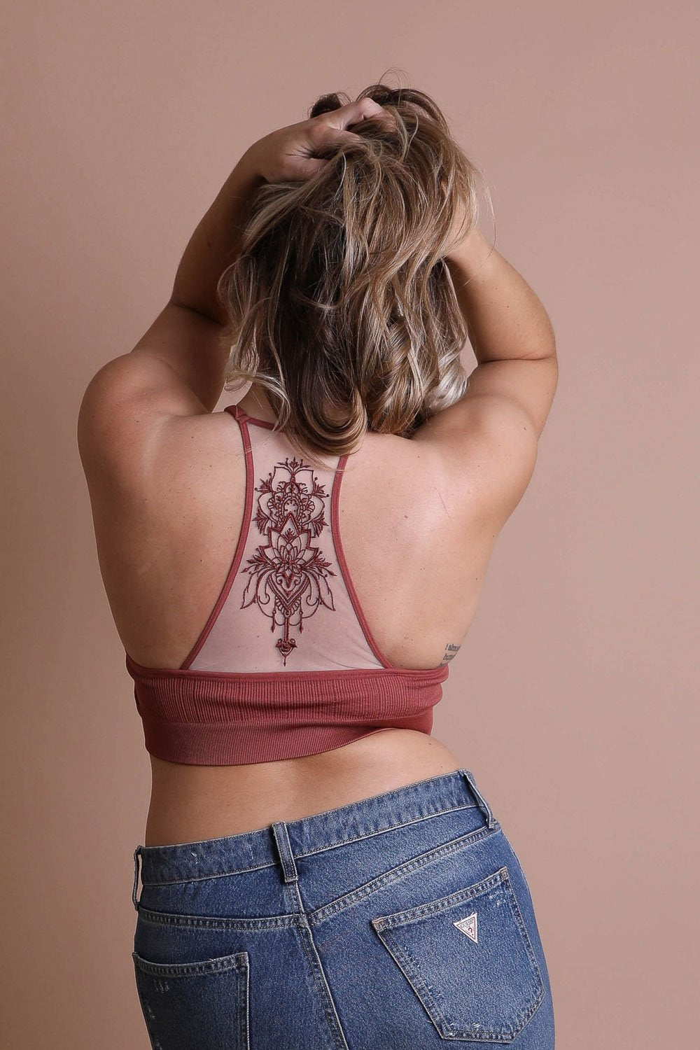 Racerback tattoo back rust bralette for comfortable layering.