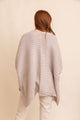 Stylish acrylic ribbed knit ruana oatmeal designed for layering in casual outfits.