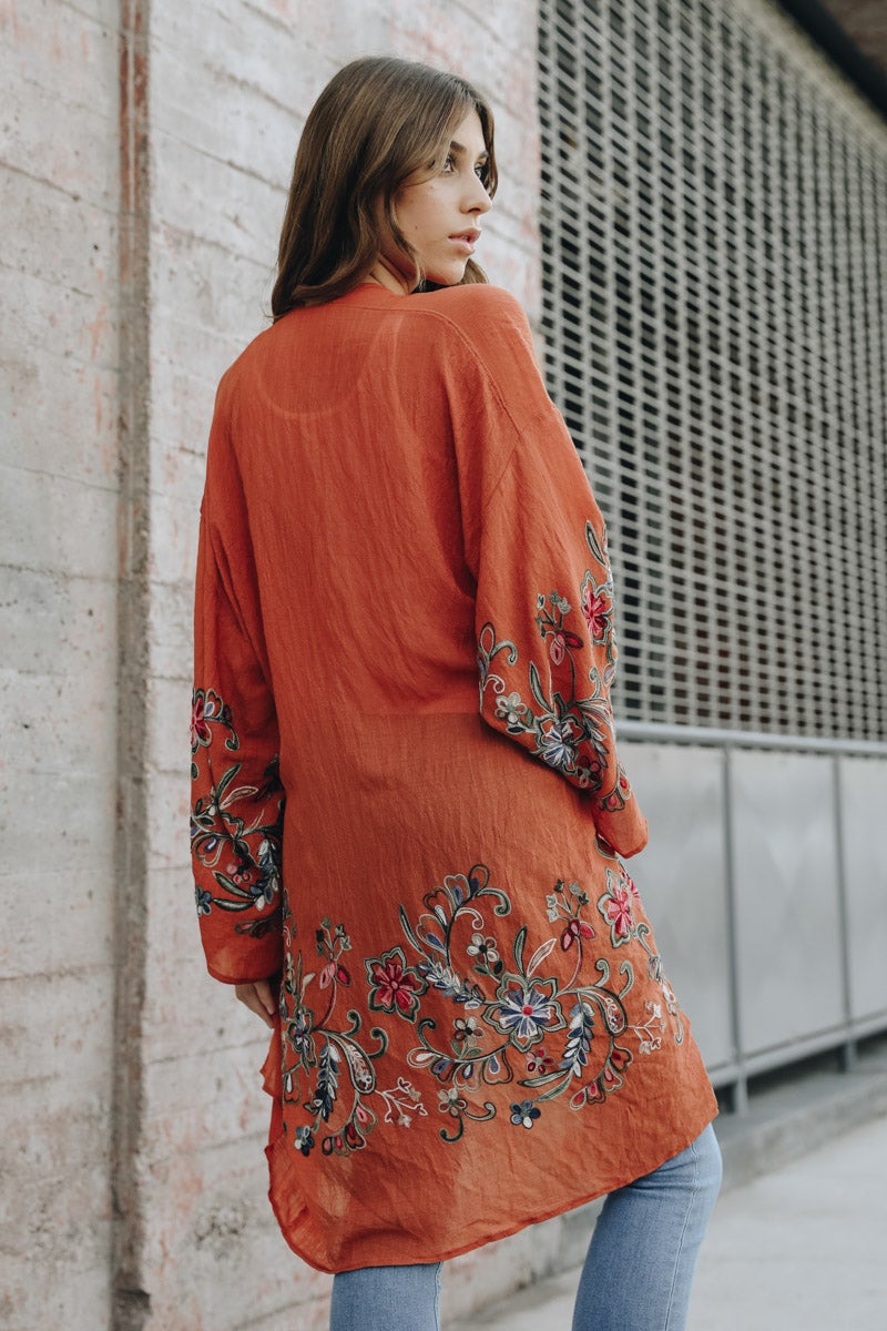 Stylish rust floral print kimono cardigan perfect for layering.