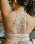 Tattoo back blush bralette with racerback style for layering.