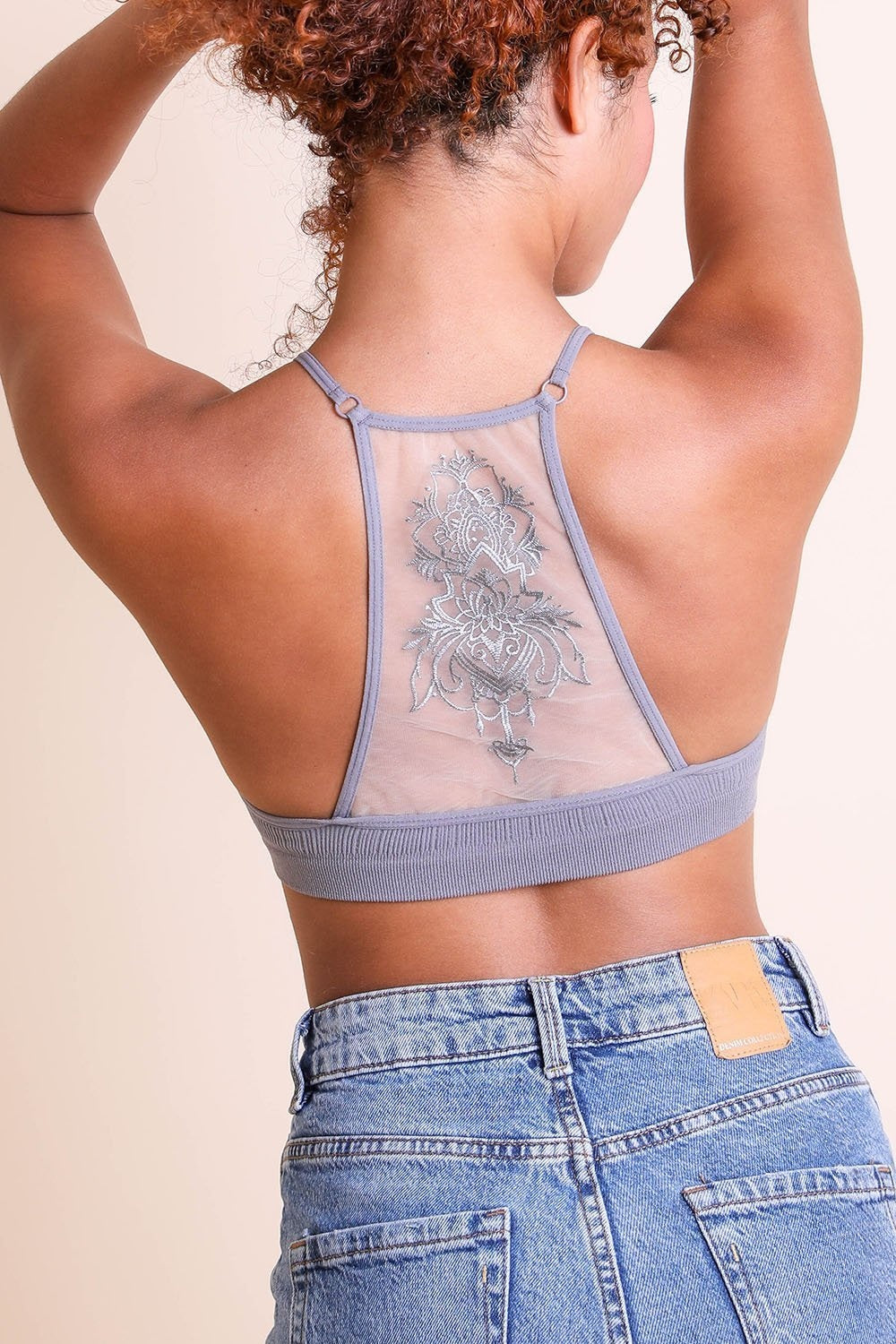 Tattoo back gray bralette with mesh detail for layering.