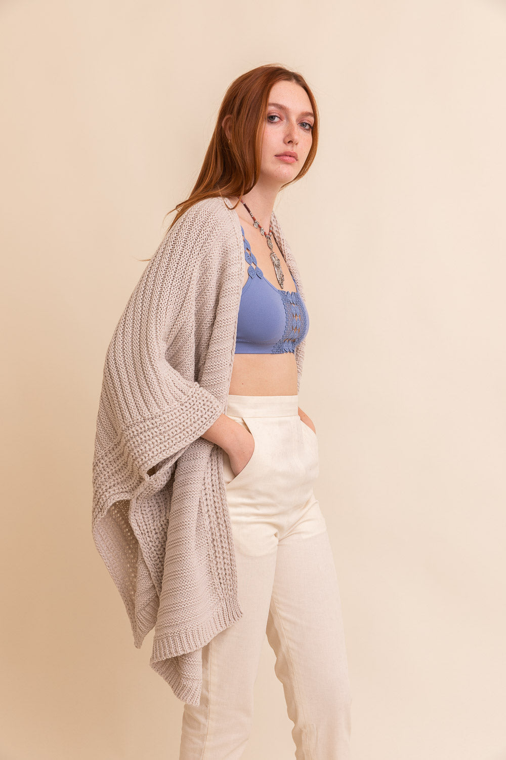 Versatile oatmeal ribbed knit ruana for everyday styling and effortless layering.